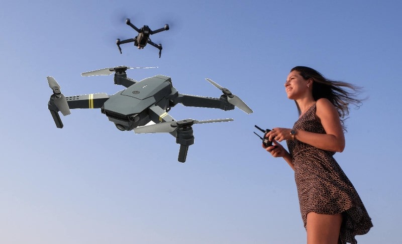 a girl operating black falcon drone in a very easy way with different different methods 